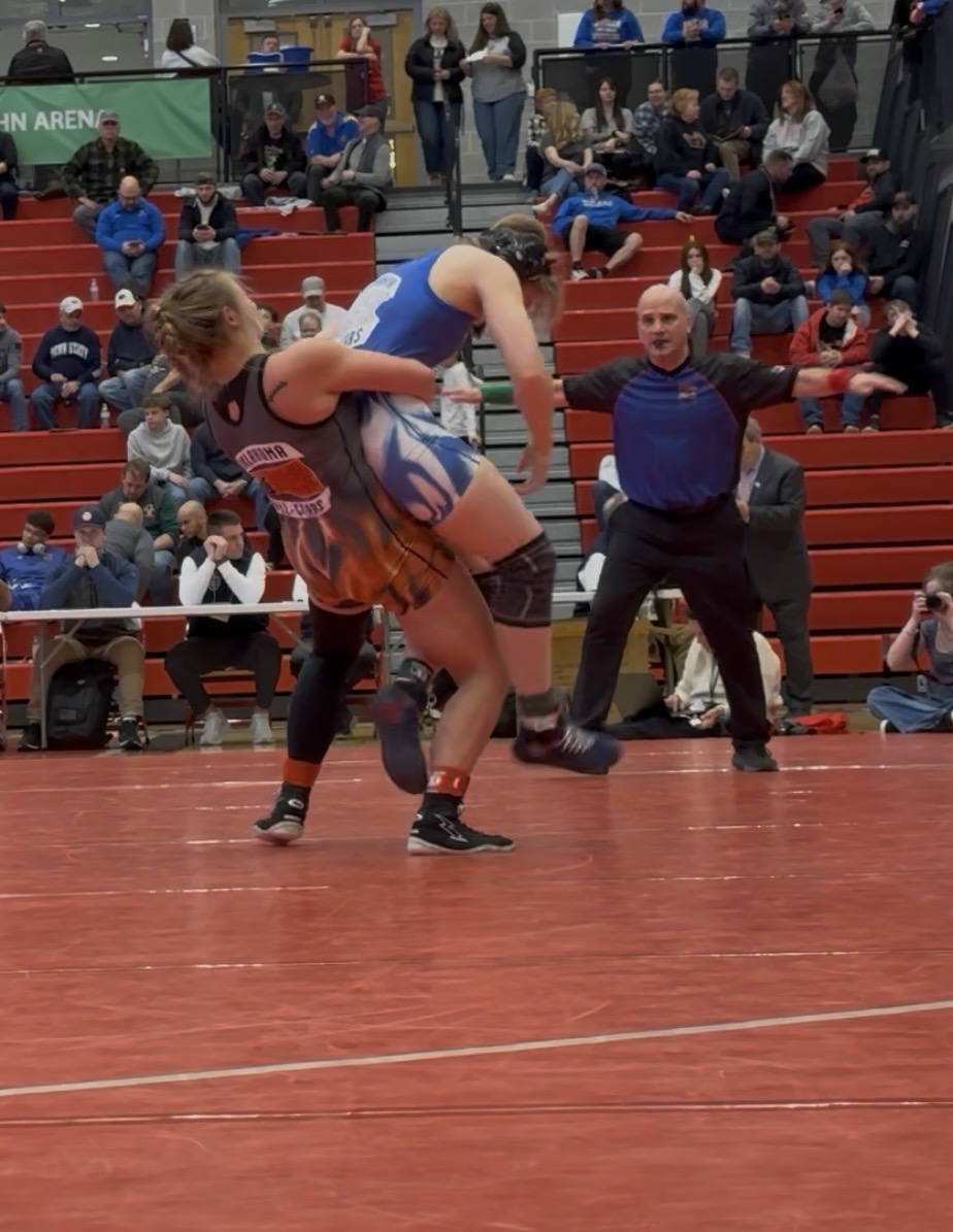 Oolagah's Piper Morton wrestling Olivya Kroope of Emmas
