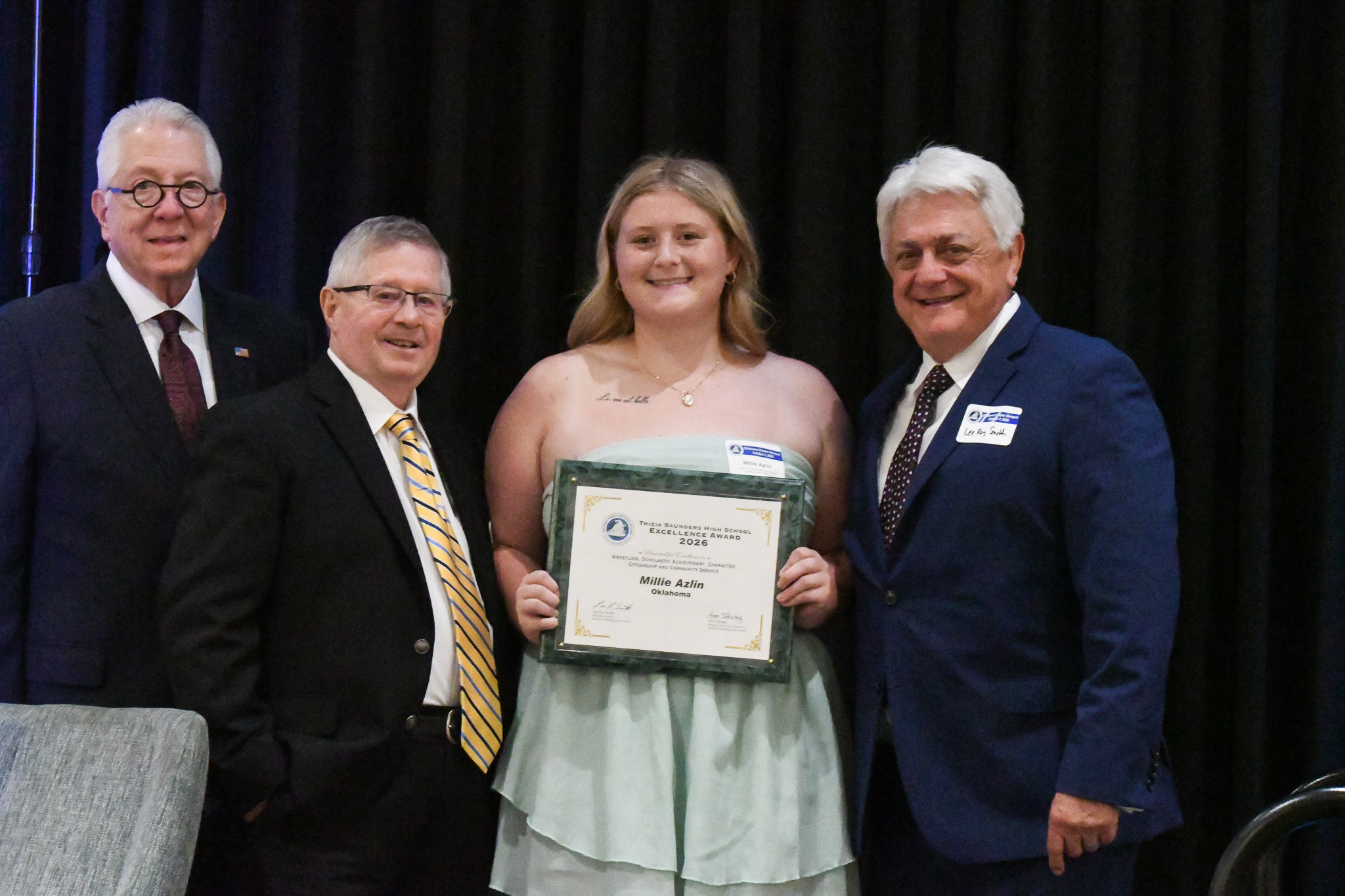 Millie Azlin receiving Tricia Saunders High School Excellence Award from A.L. Haizlip, Steve Ferguson, and Lee Roy Smith